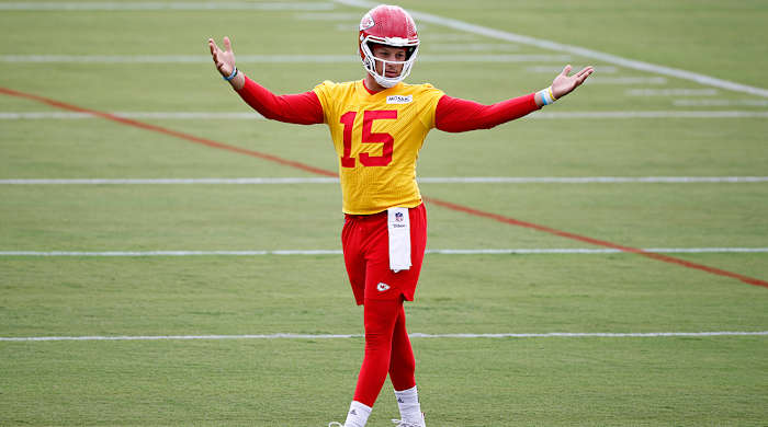 Chiefs quarterback Patrick Mahomes reacts during a morning workout at the team's NFL football training camp facility.